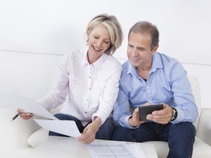 Happy couple plans refinance loan for security. 