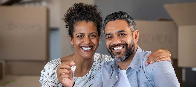 Couple in a new home with keys